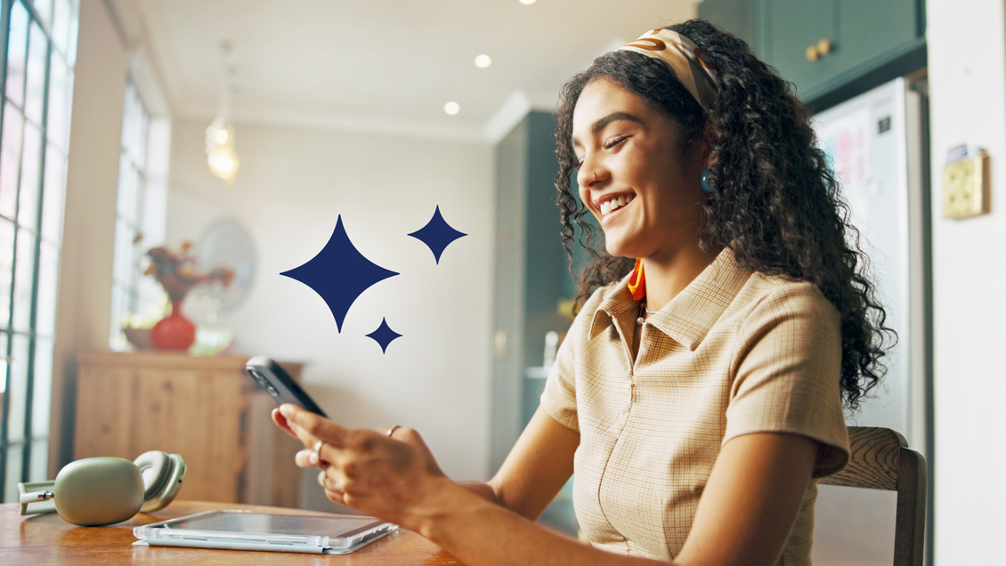 Woman looking at her phone smiling