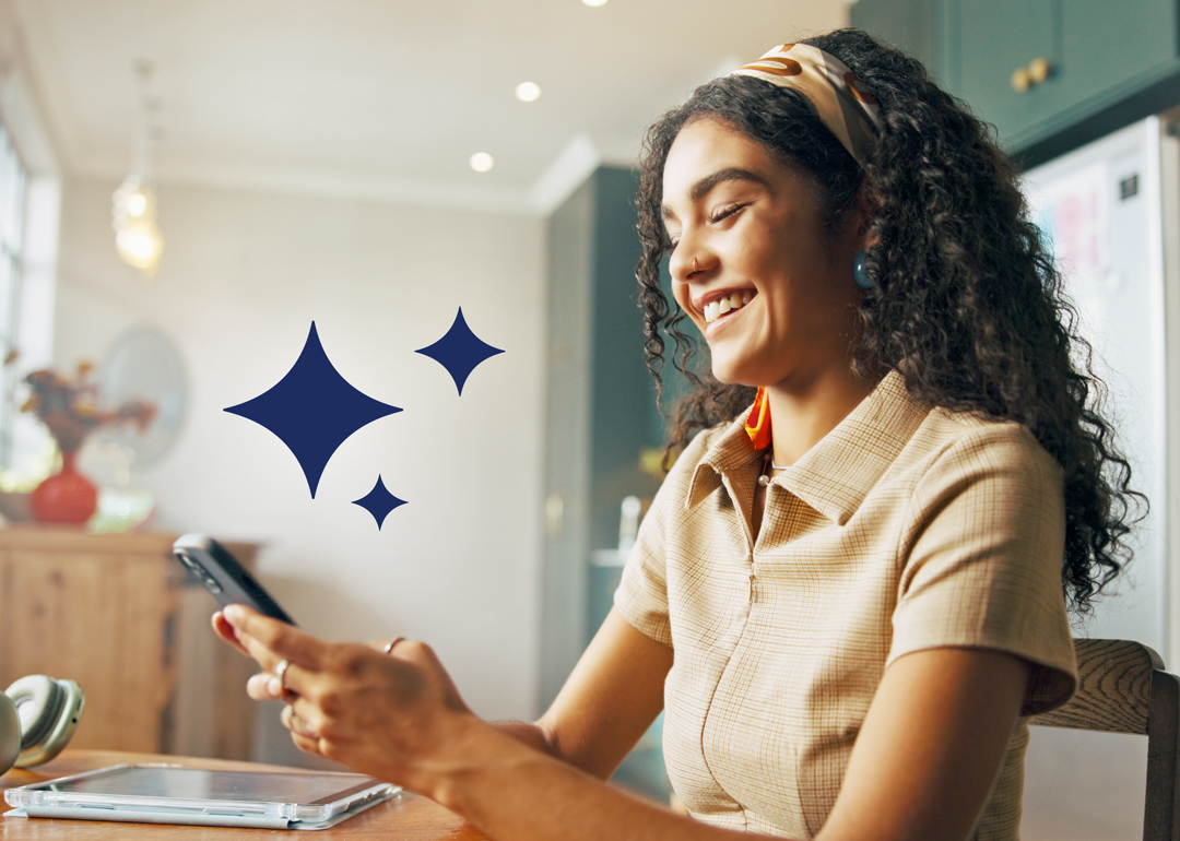 Woman looking at her phone smiling