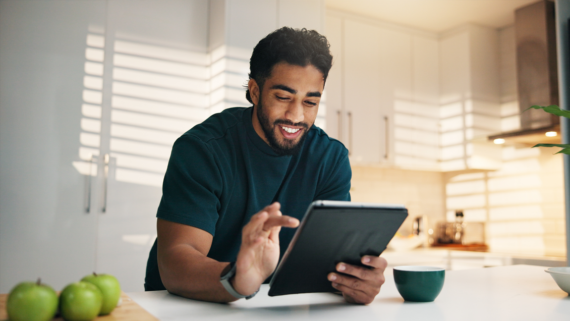 man holding tablet searching on google